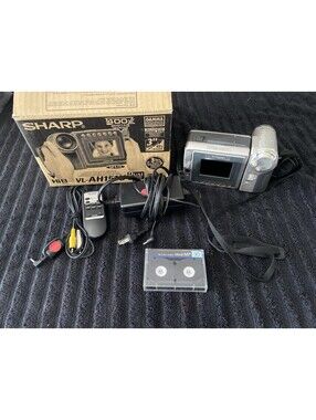 Sharp VL-AH151U Camcorder working tested with box and charger and battery